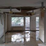 Water damage in interior room of abandoned building.