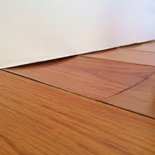 How to Dry Water Under Hardwood Floors Before Serious Damage Occurs | Water Rehab Restoration