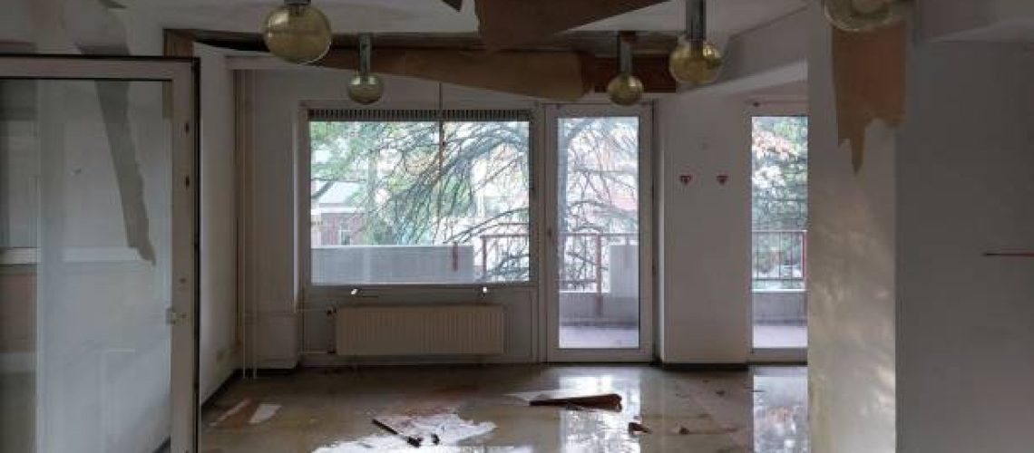 Water damage in interior room of abandoned building.